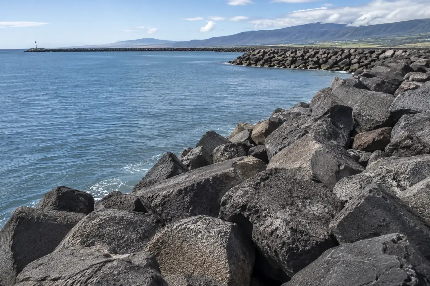 Large riprap rocks protecting a harbor shoreline